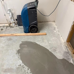Professional dehumidifier drying water-damaged area