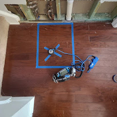 Leak detection equipment on hardwood floor