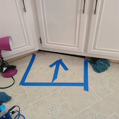 Blue tape marking exact location of detected water leak