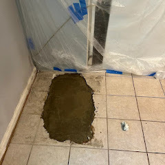 Concrete patch after slab leak repair in bathroom